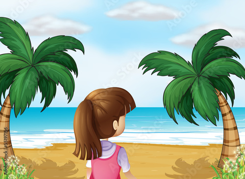 A young lady watching the calm blue sea