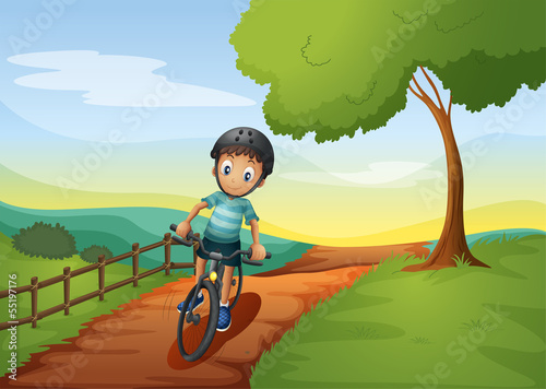 A boy going to the farm with his bike