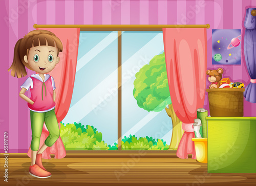 A girl inside the house with her toys