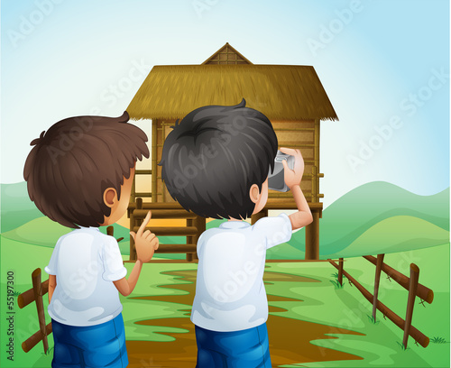 Boys taking photos at the farm