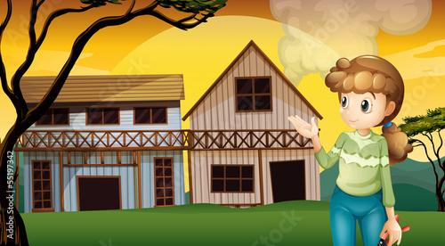A woman with a cutter standing in front of the houses