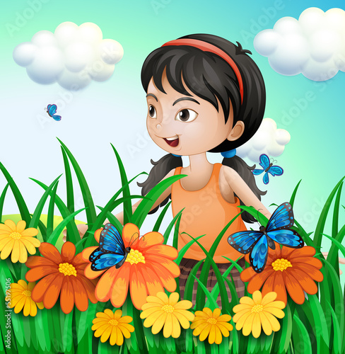 A girl in the garden with butterflies