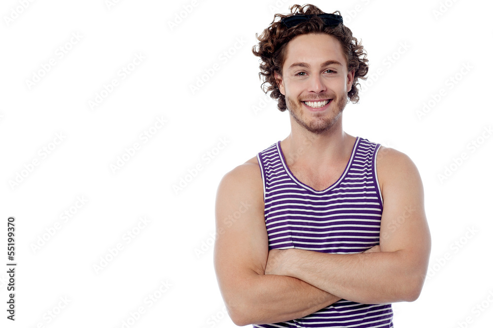 Smiling young guy posing casually Smiling young guy posing casually