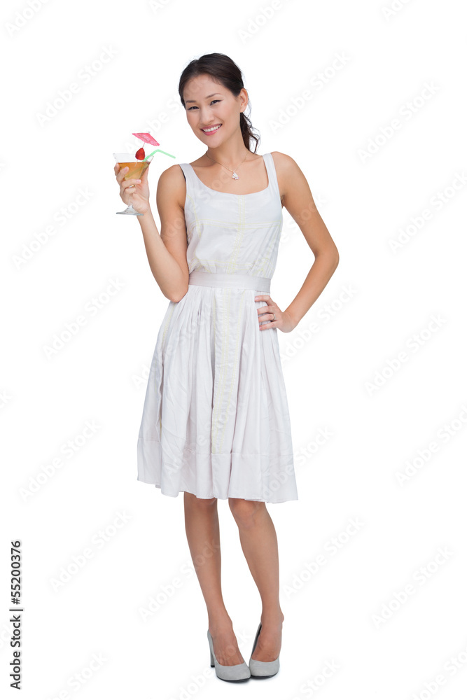 Relaxed brunette posing with cocktail Relaxed brunette posing with cocktail