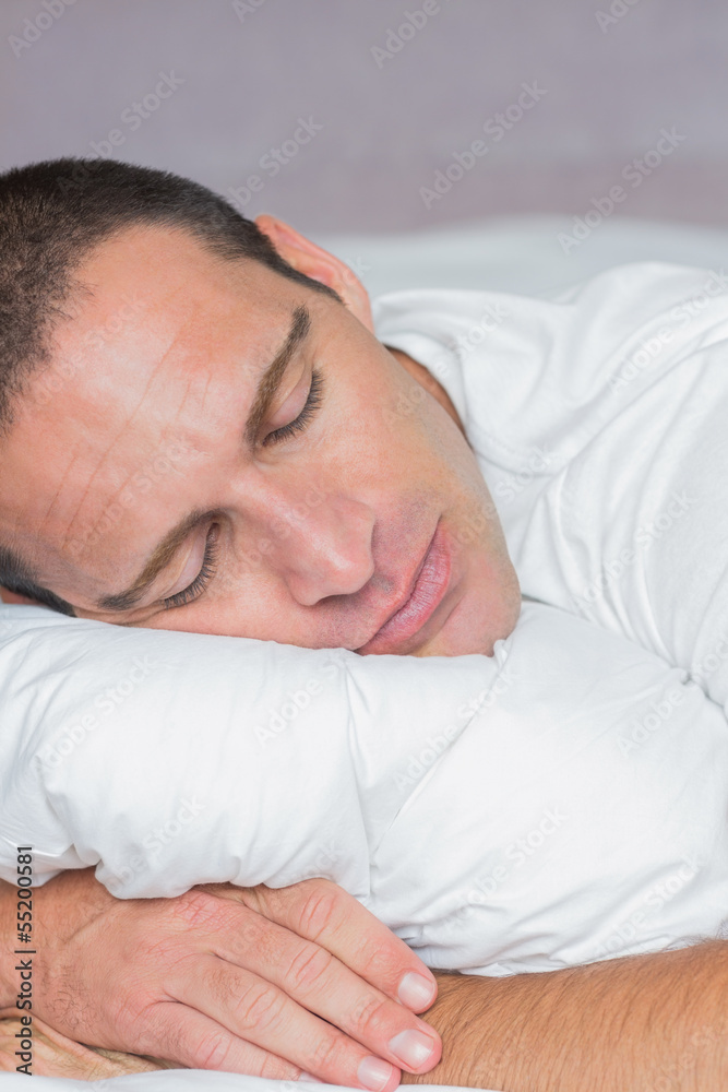 Handsome man sleeping on his pillow Handsome man sleeping on his pillow