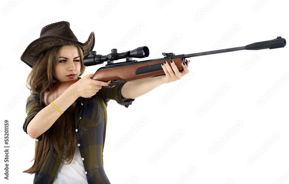 Beautiful Cowgirl with a gun on a white background.