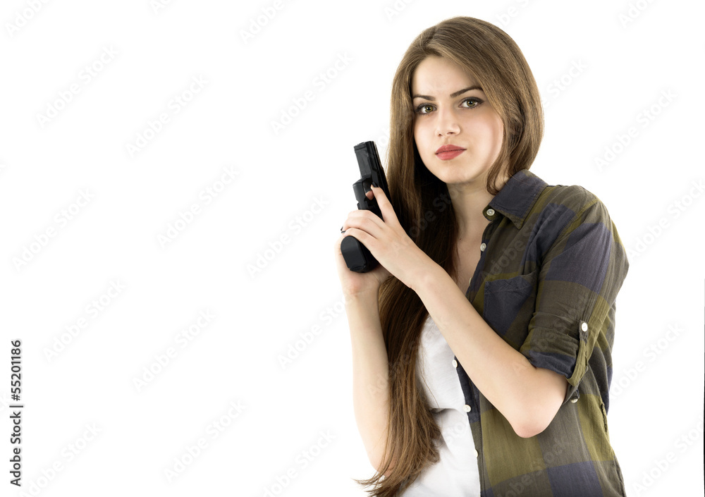 Young beautiful woman holding a gun on white background Young beautiful woman holding a gun on white background