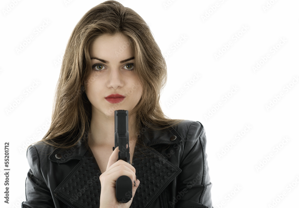Young beautiful woman holding a gun on white background Young beautiful woman holding a gun on white background