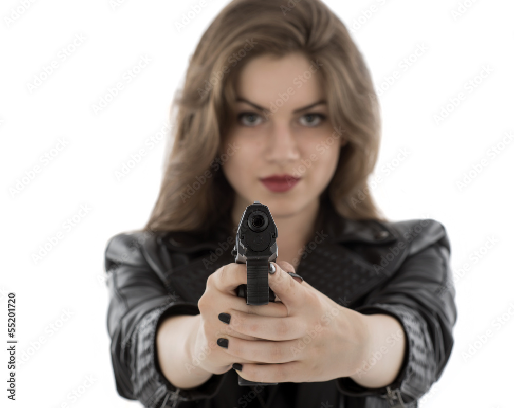Young beautiful woman holding a gun on white background Young beautiful woman holding a gun on white background