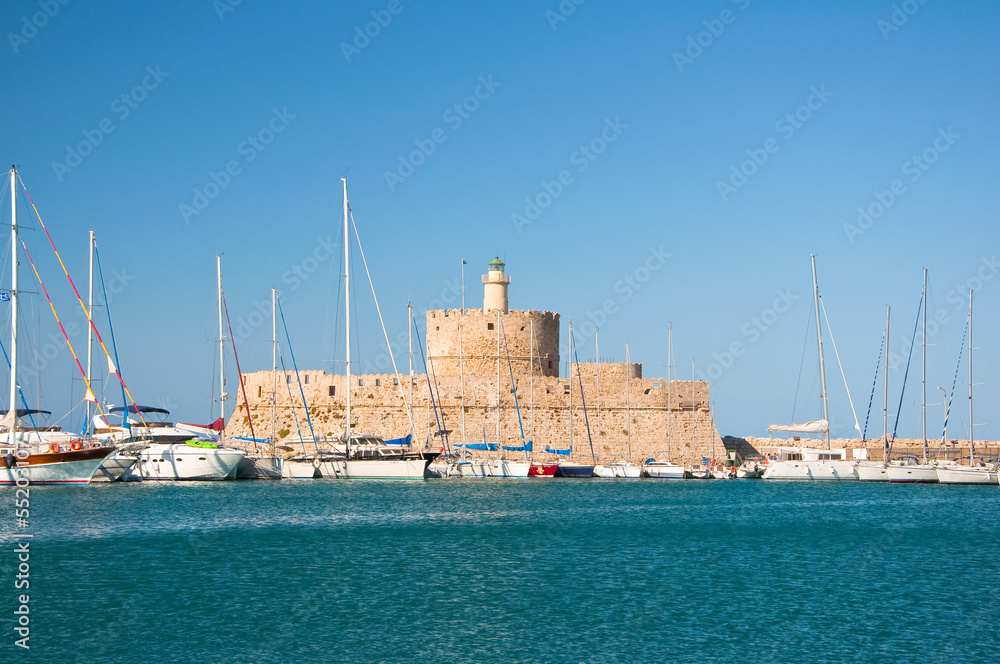 The old fortress and the lighthouse on Rhodes island, Greece.