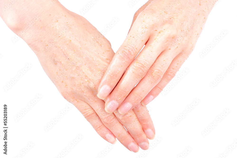 Fototapeta premium Hand of woman puts a cosmetic cream, peeling hand,