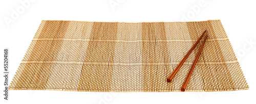Chopsticks over a bamboo mat