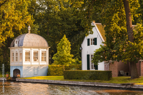 Old boathouse alongside the Dutch Vecht river photo