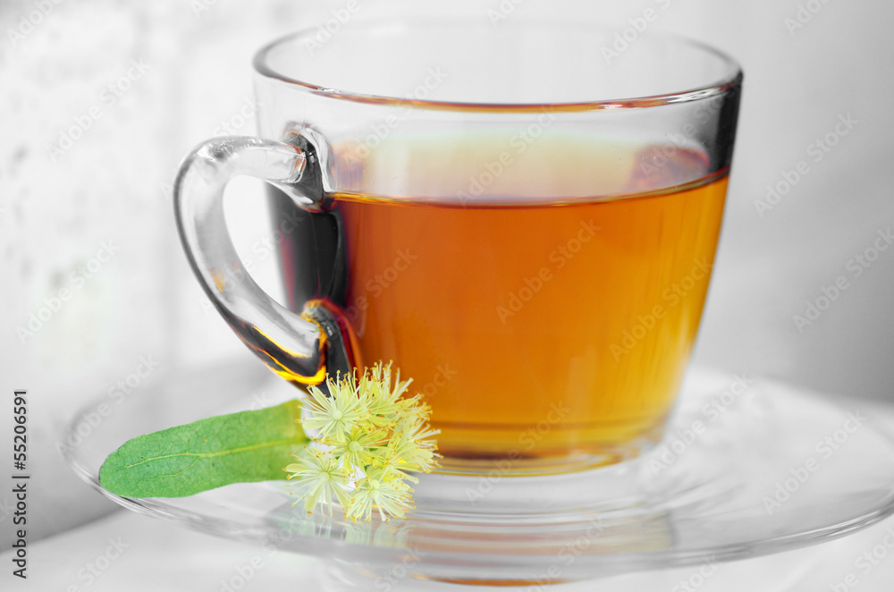 Glass cup of tea with linden