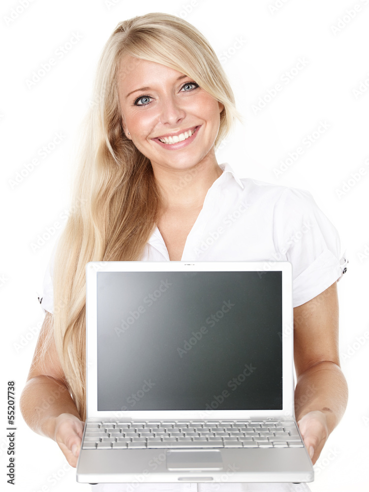 Business woman pointing at her laptop with copyspace