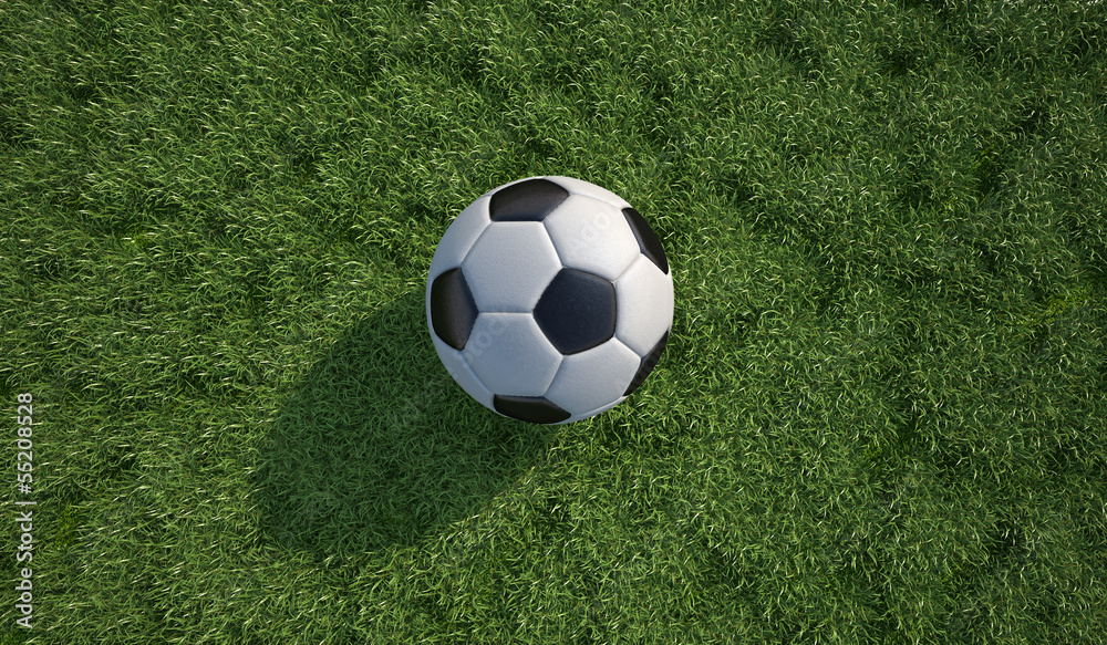 Soccer/football ball close up on grass lawn. Top view. Soccer/football ball close up on grass lawn. Top view.