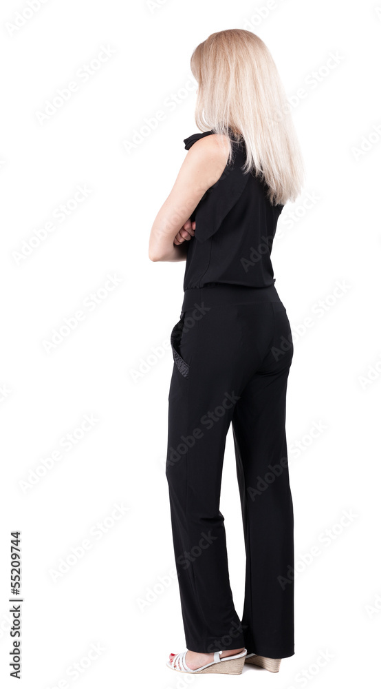 back view of standing young beautiful blonde woman. back view of standing young beautiful blonde woman.