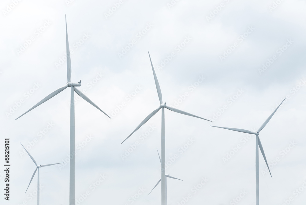 wind turbine in wind farm against cloudy sky wind turbine in wind farm against cloudy sky