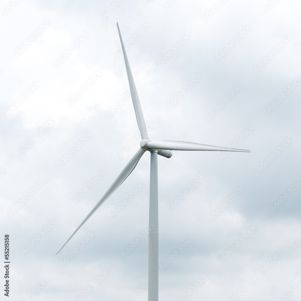 wind turbine in wind farm against cloudy sky wind turbine in wind farm against cloudy sky