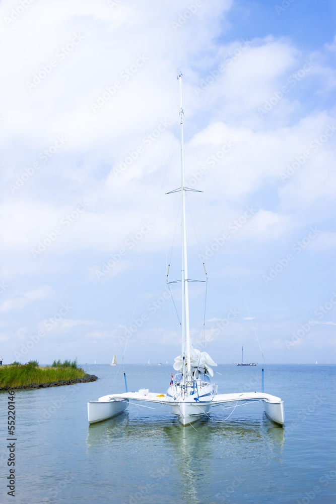 Catamaran on the water, Marken, the Netherlands Catamaran on the water, Marken, the Netherlands