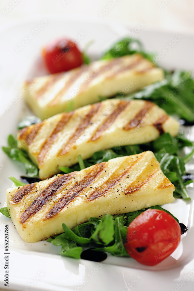 Grilled Halloumi cheese on rocket salad Grilled Halloumi cheese on rocket salad