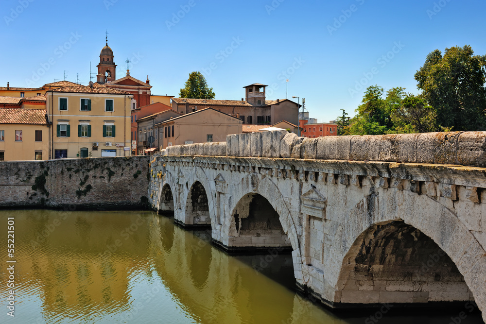 Historical roman Tiberius' bridge over Marecchia river in Rimini