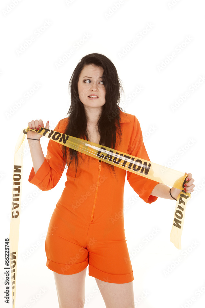 Woman orange prison caution look side Woman orange prison caution look side