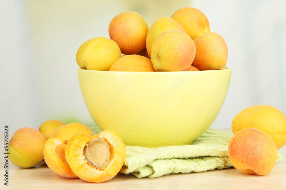 Fresh natural apricot in bowl on table in kitchen Fresh natural apricot in bowl on table in kitchen
