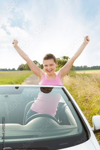 Woman Raising Hand In Car