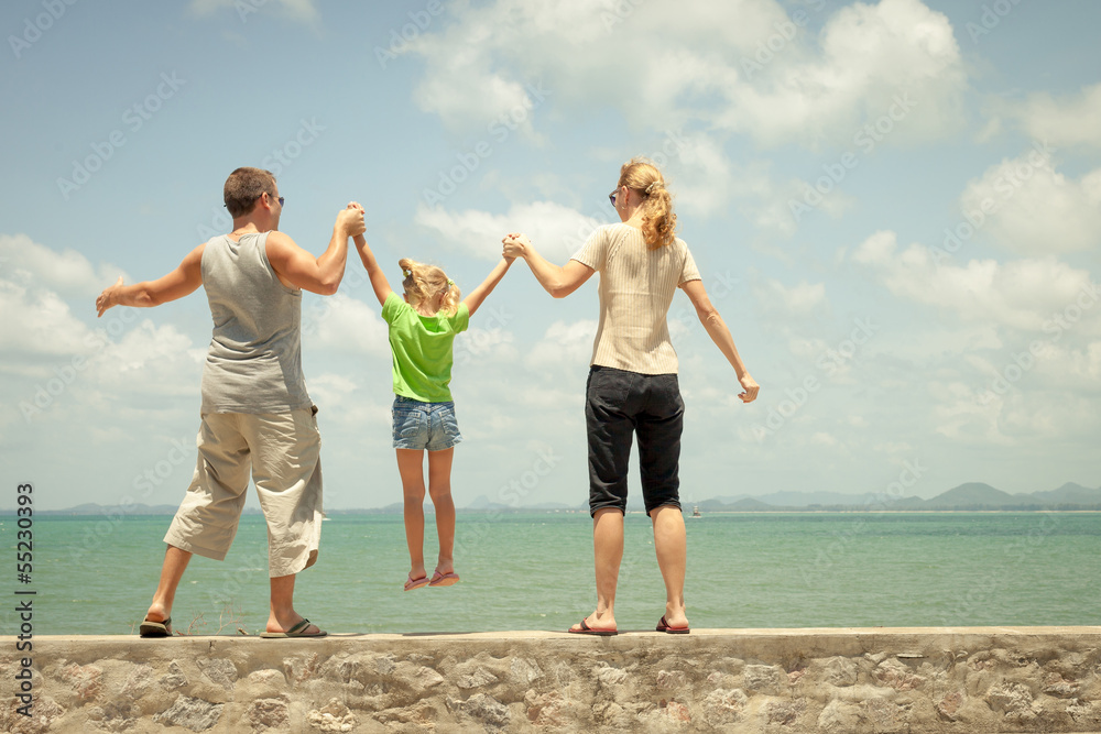 Happy family near the beach in the day time Happy family near the beach in the day time