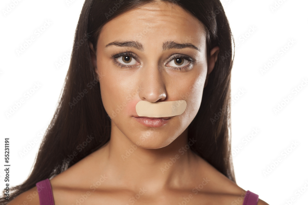 patch under her nose because of bad waxing her mustache Stock Photo