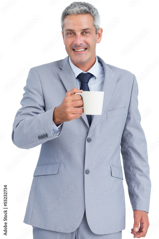 Cheerful businessman holding mug Cheerful businessman holding mug