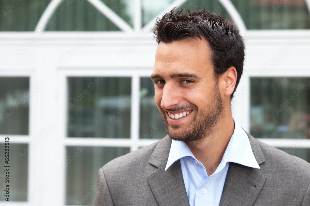 Laughing business man in a suit