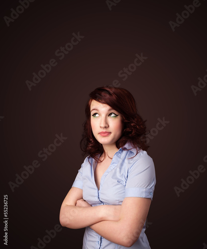 Young woman thinking with copy space