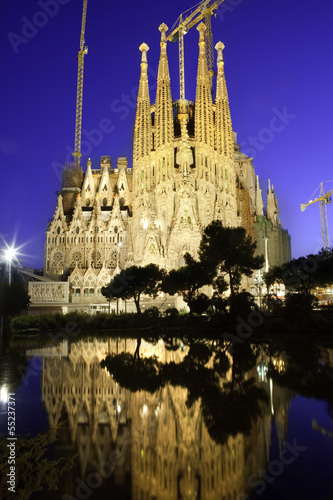 Sagrada Familia at dusk, with beautiful reflections in a lake.