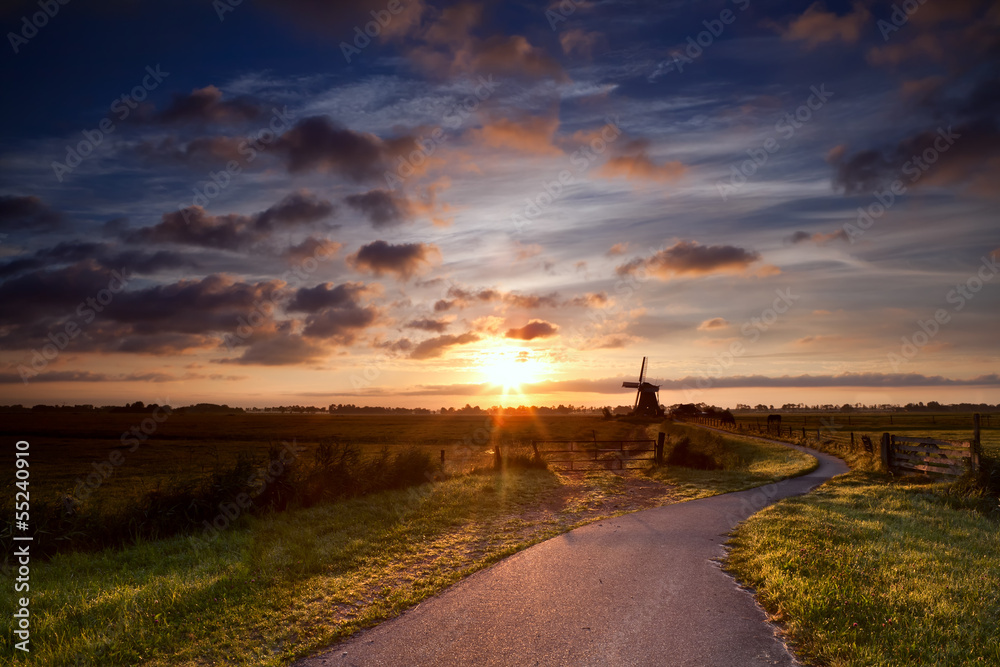 warm sunbeams by Dutch windmill