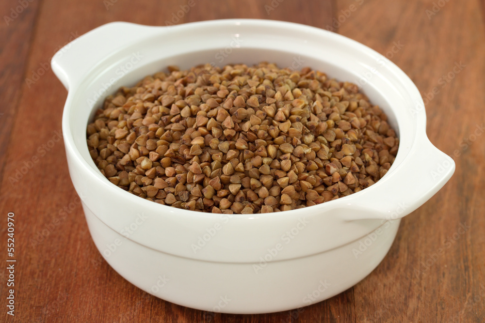 buckwheat in white bowl in dark background buckwheat in white bowl in dark background