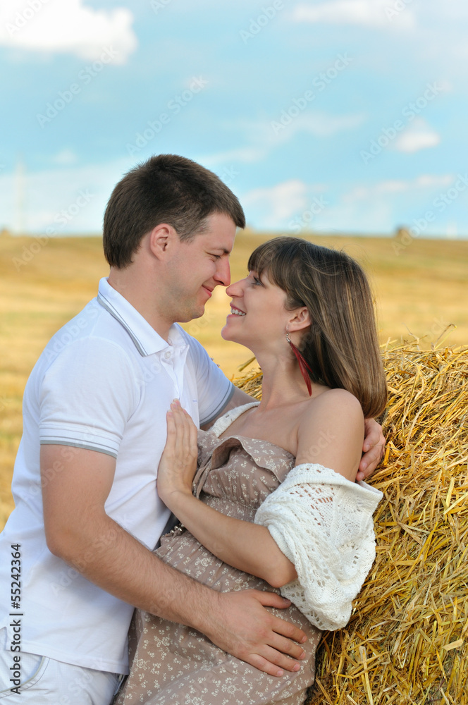 Cheerful future parents in the field Cheerful future parents in the field