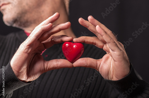 a man holding heart