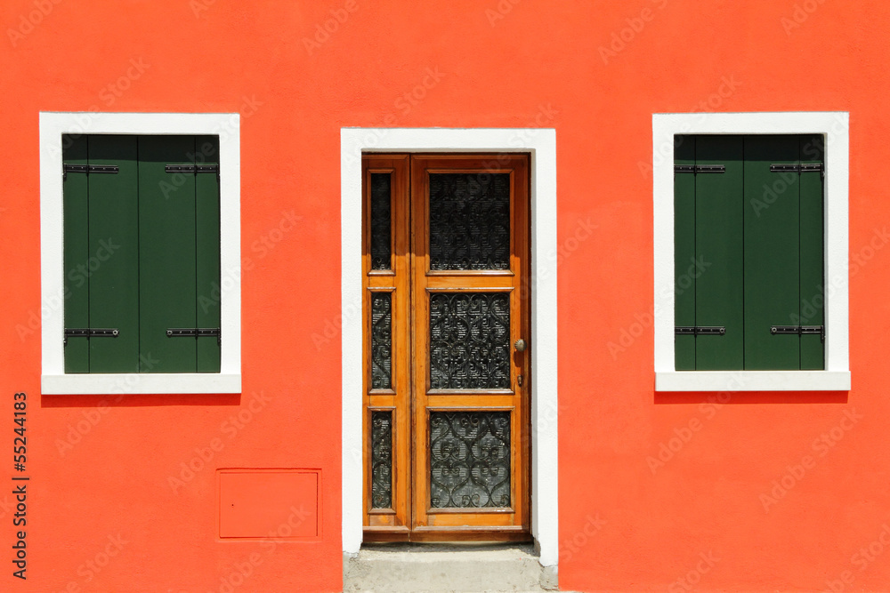 Naklejka premium front door in vivid painted house in Burano village