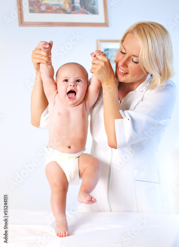 Doctor pediatrician and baby. First steps