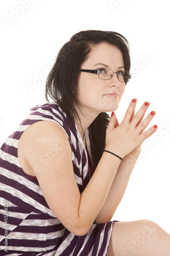 Woman striped purple dress hands together