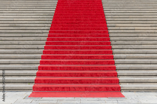 Stone staircase with red carpet