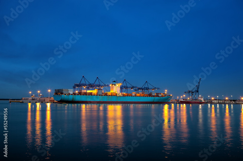 Obraz na płótnie Large container ship on loading in the port of Gdansk, Poland w salonie