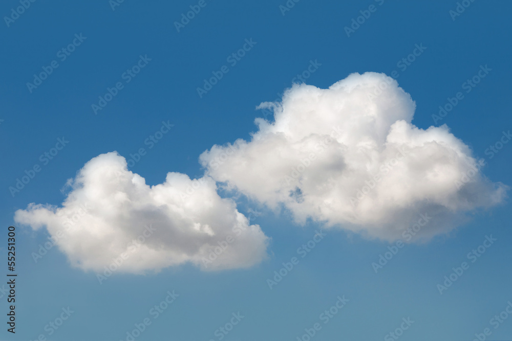 Fluffy white clouds in the blue sky Fluffy white clouds in the blue sky