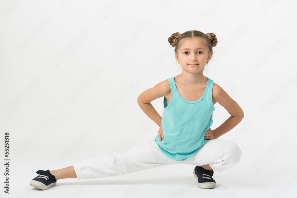 girl sitting with hands on belt and makes gymnastic exercise girl sitting with hands on belt and makes gymnastic exercise