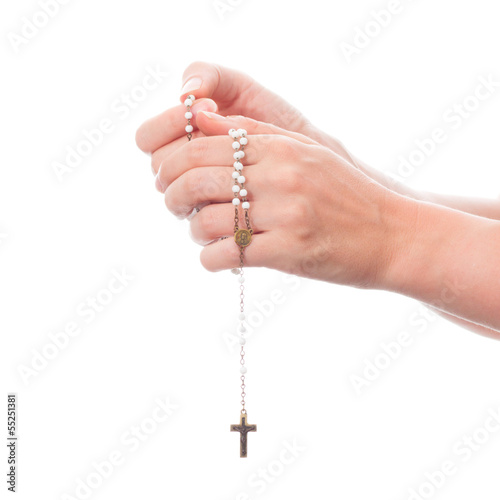 female hands holding rosary - isolated on white background