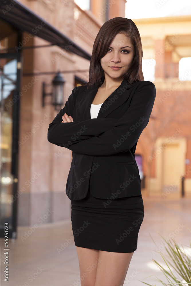 Pretty business woman stands with her arms crossed. Pretty business woman stands with her arms crossed.