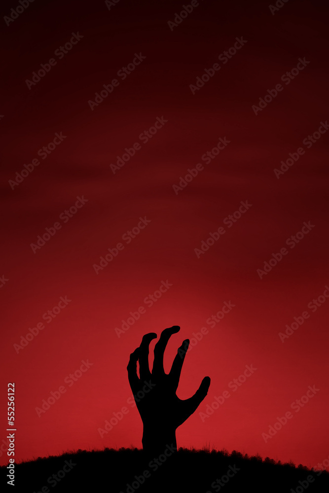 Naklejka premium Zombie hand coming up
