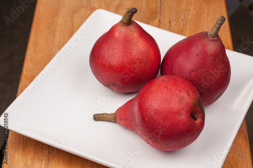 Red Pears on a White Plate